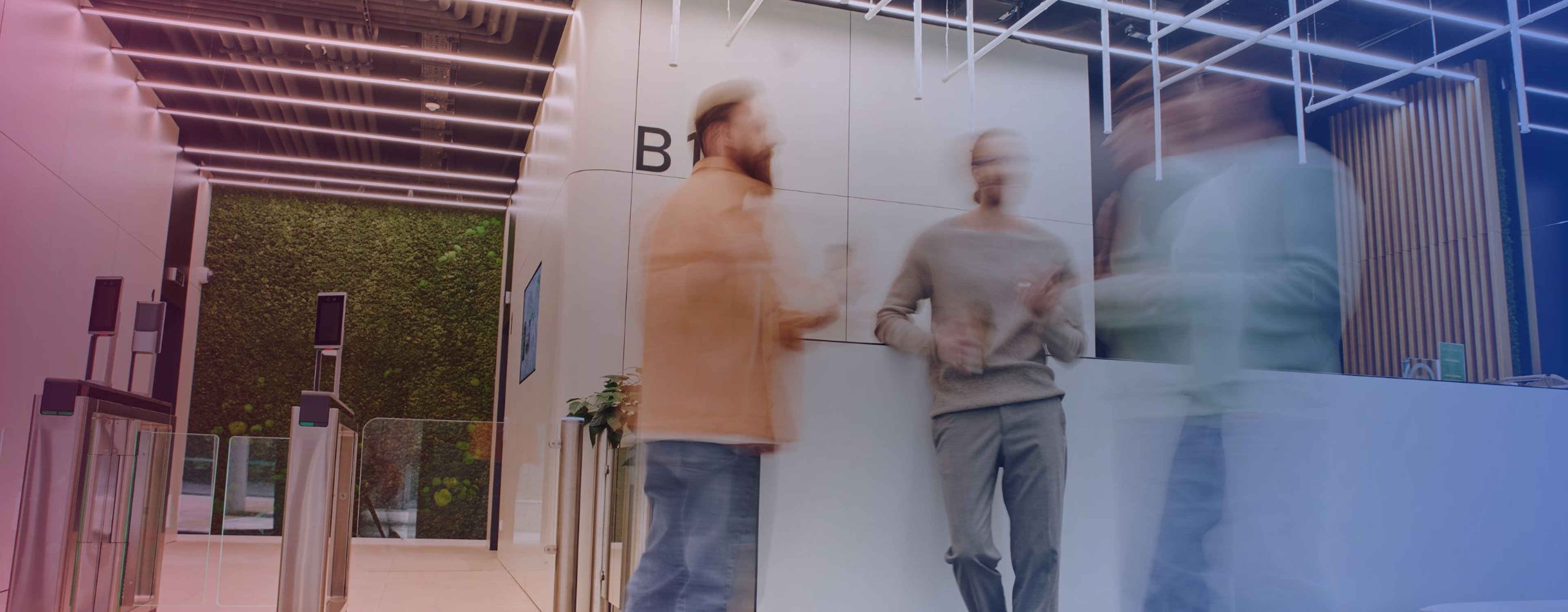 Stock image of employees talking in an office