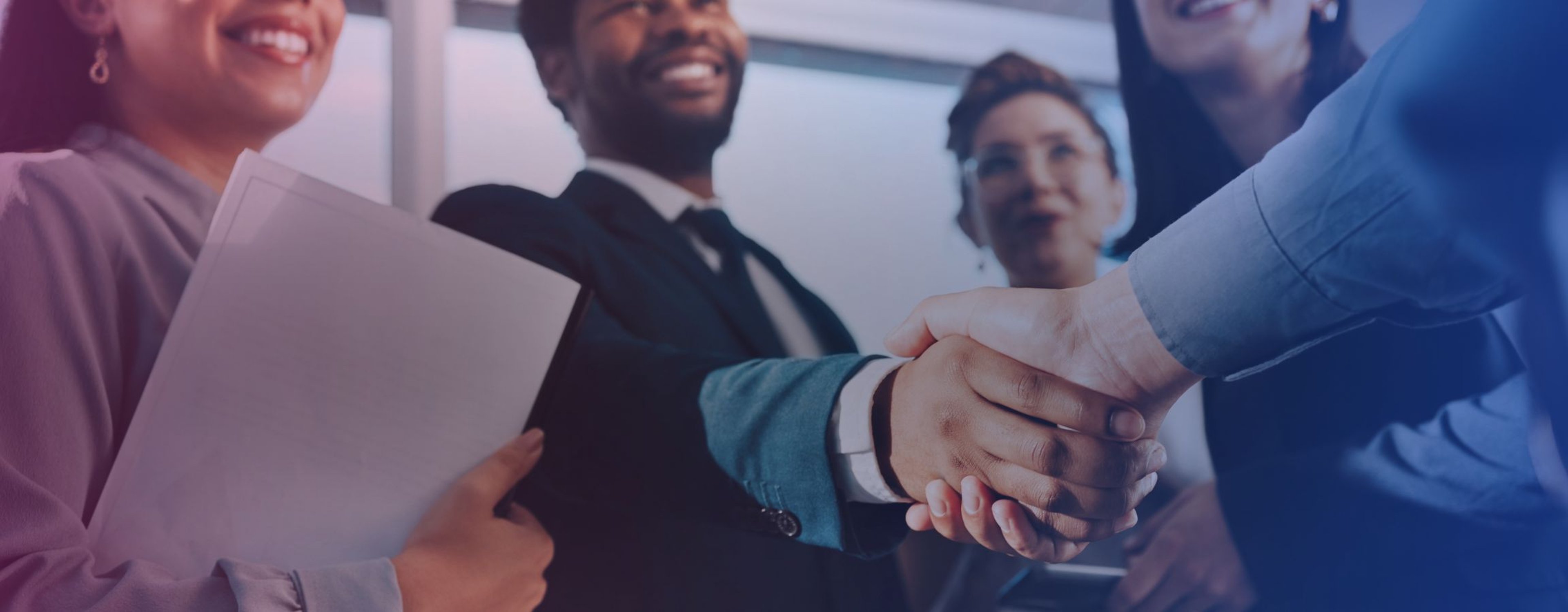 Business employees shaking hands