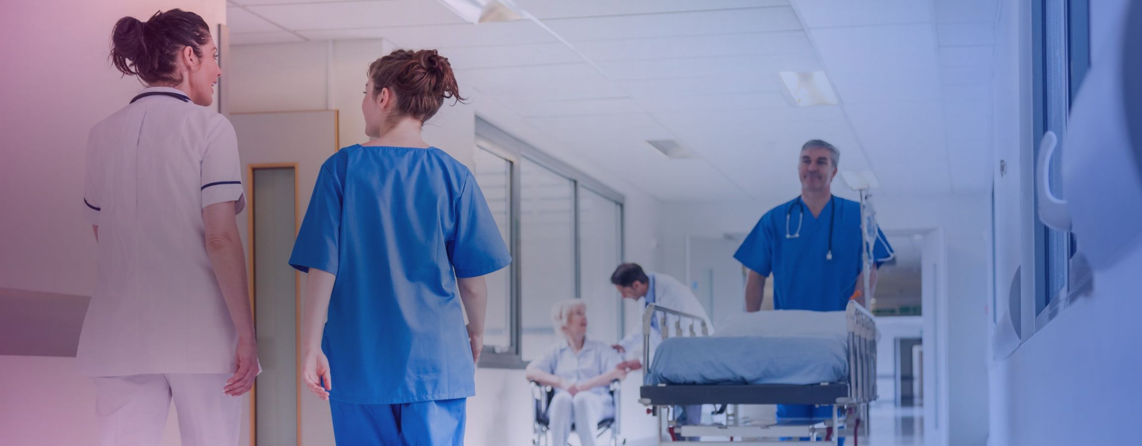 Stock image of staff walking through a hospital
